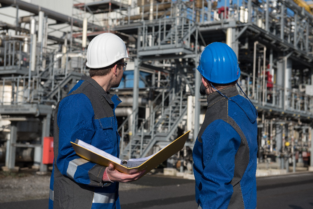 engineeris looking at a power plant